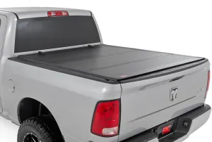 Rough Country Hard Flip Up Truck Bed Tonneau Cover for Ram 1500, Classic (2009-2018) - Fits 5'7" (67.4") Bed, Weather-Resistant, Tri-Fold Aluminum Panels